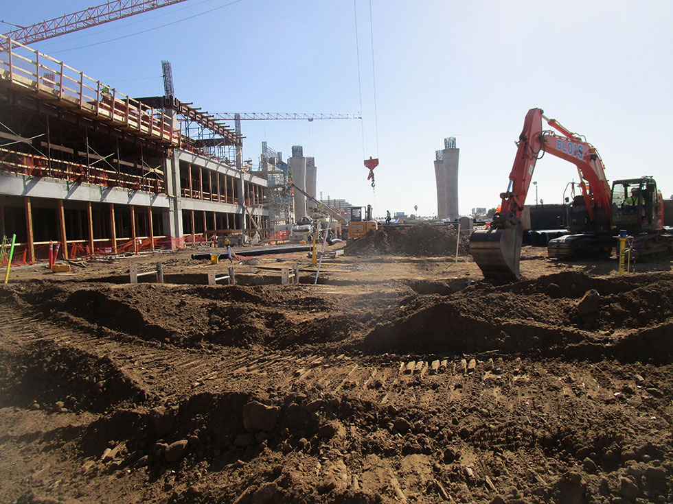 Excavating trenches