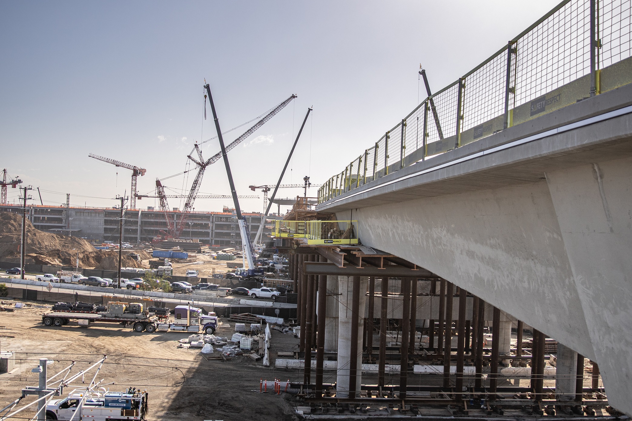 Work continues on the Automated People Mover guideway superstructure as it approaches the future Consolidated Rent-A-Car facility.