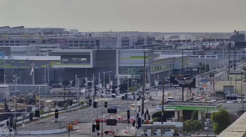 View looking west on Arbor Vitae Street showing street widening alongside the northern and western edges of Consolidated Rent-A-Car facility property.